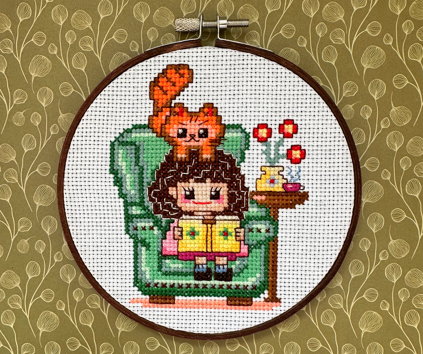 Cute girl in chair with book PDF cross stitch pattern