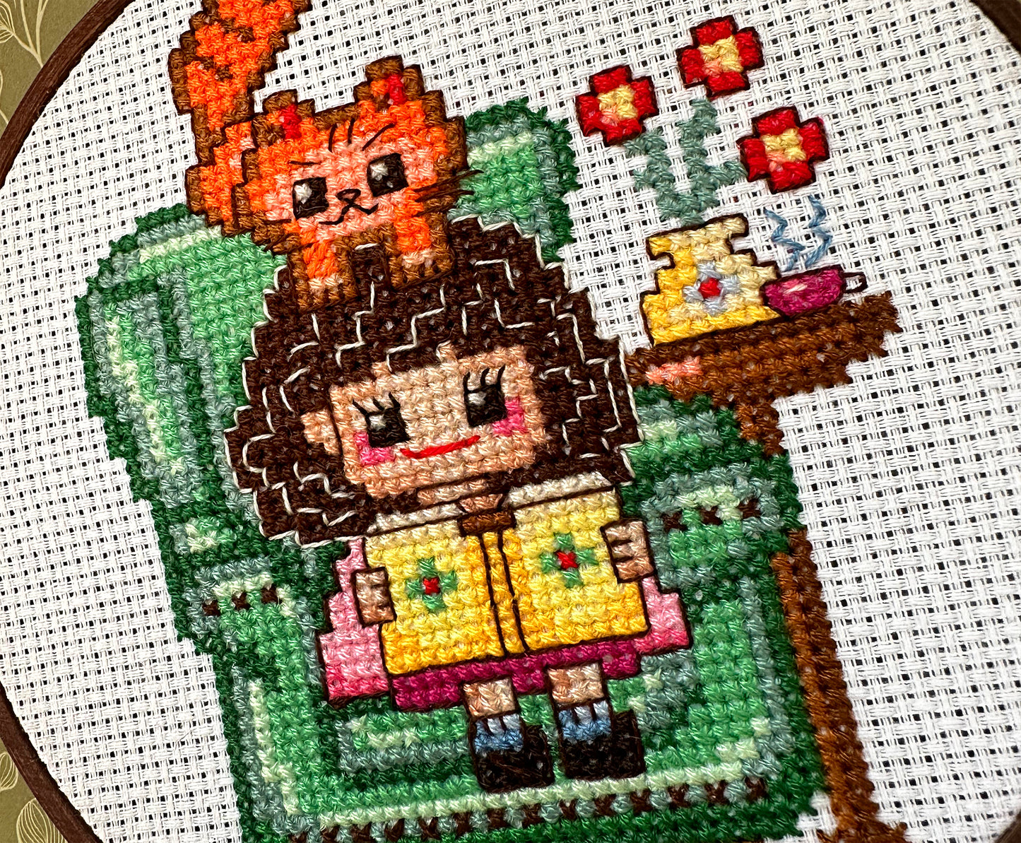 Cute girl in chair with book PDF cross stitch pattern