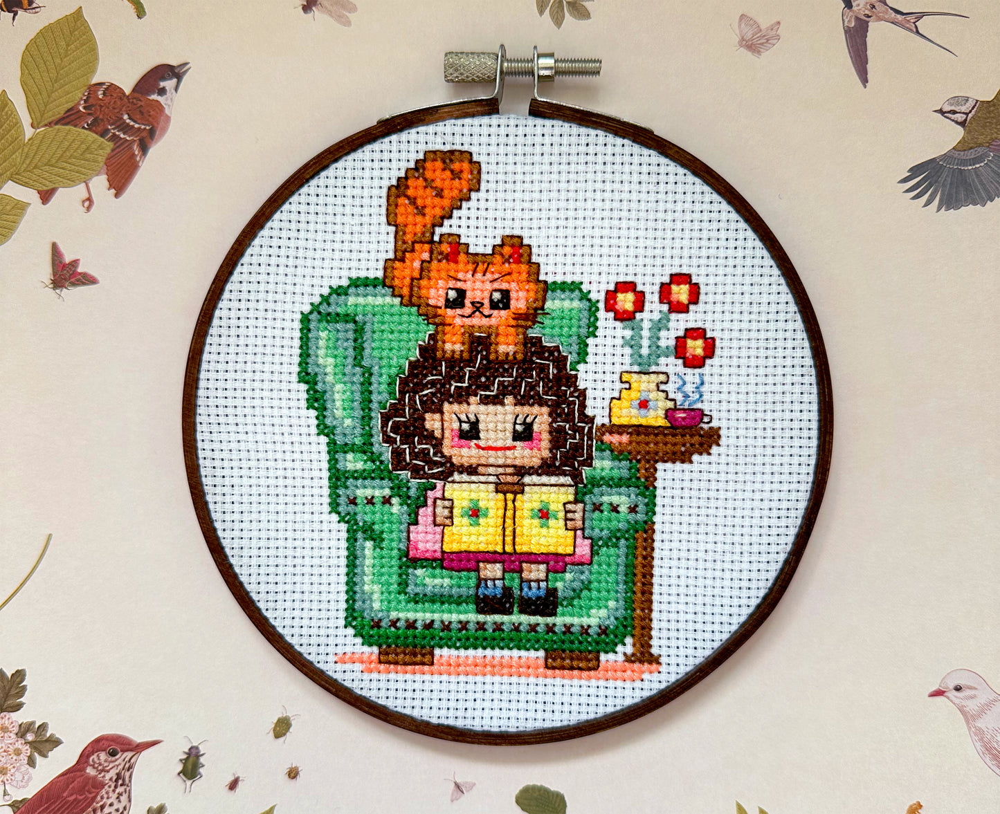 Cute girl in chair with book PDF cross stitch pattern