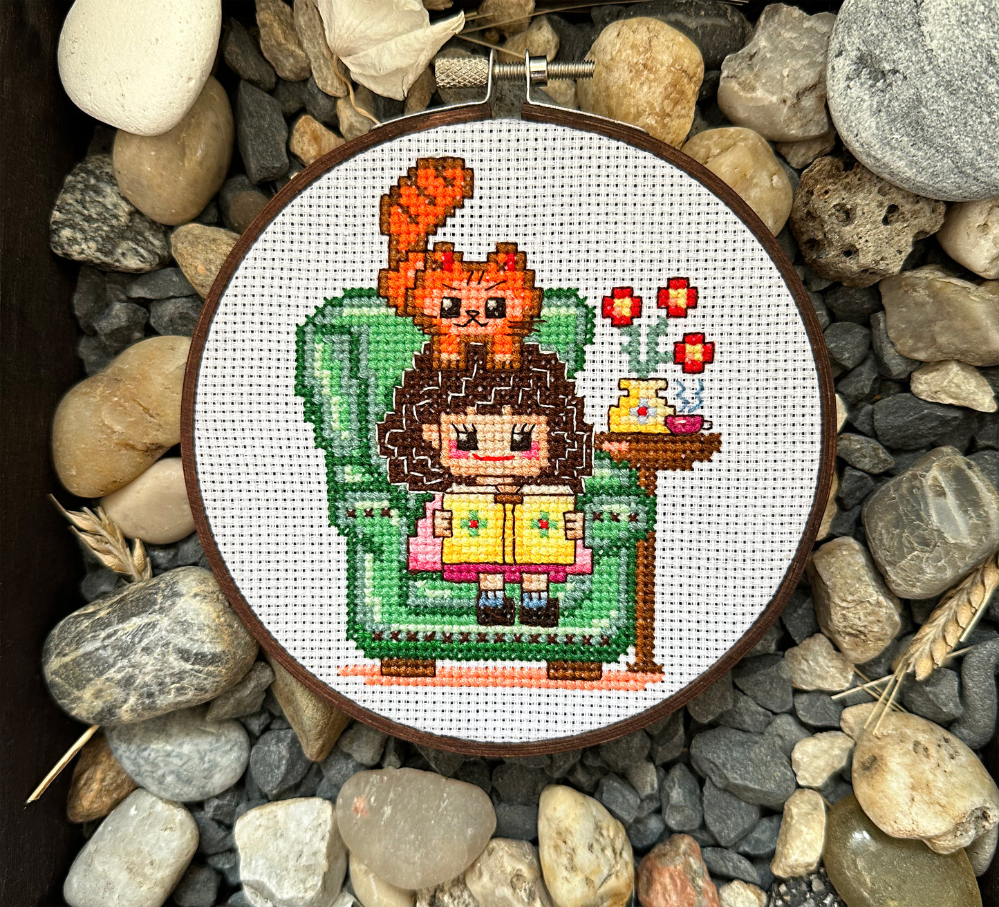 Cute girl in chair with book PDF cross stitch pattern