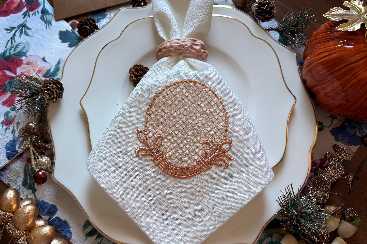 Decorative retro-style embroidery frame stitched on white linen napkin.