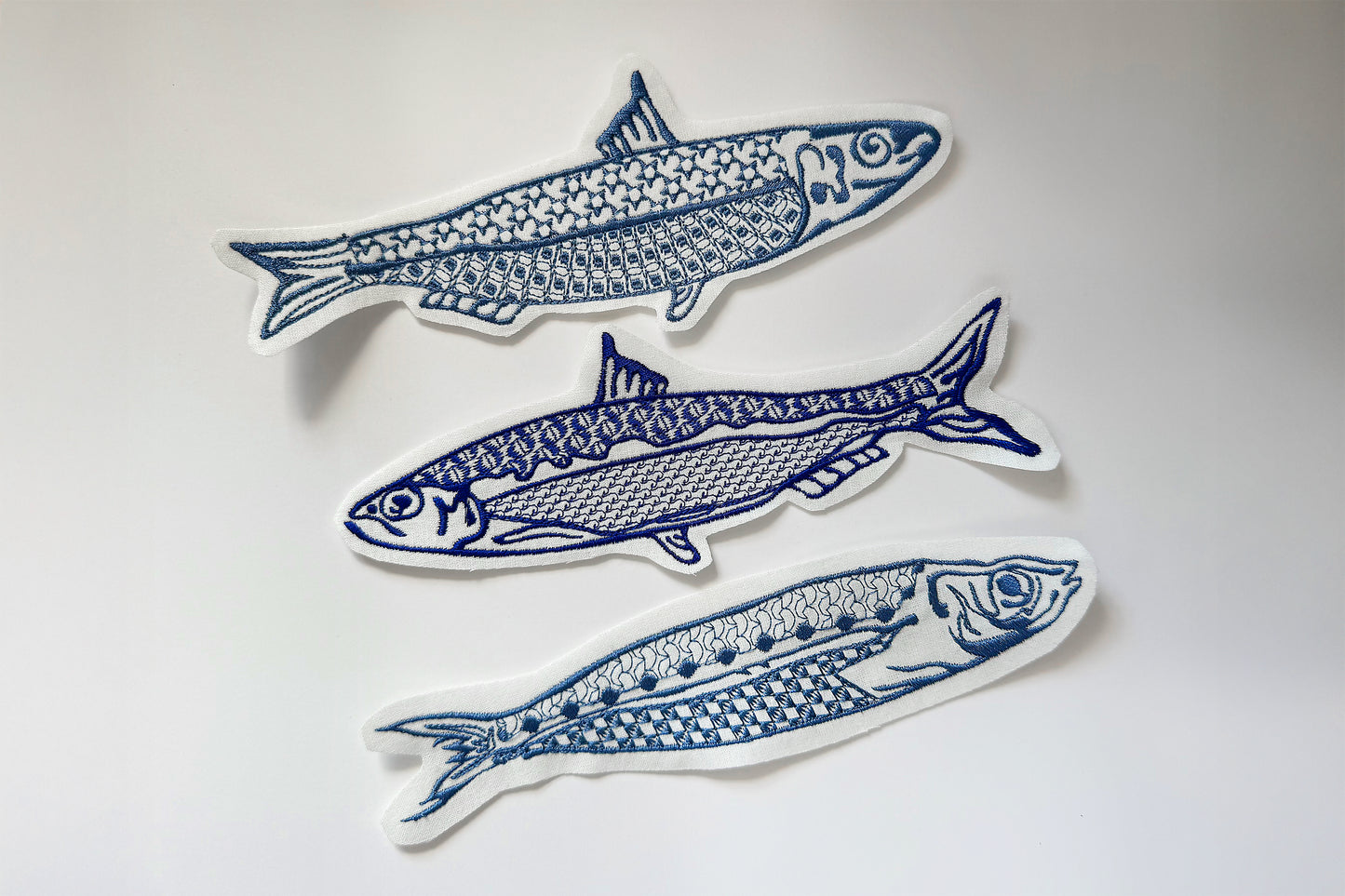 3. Unique sardine machine embroidery on white fabric background