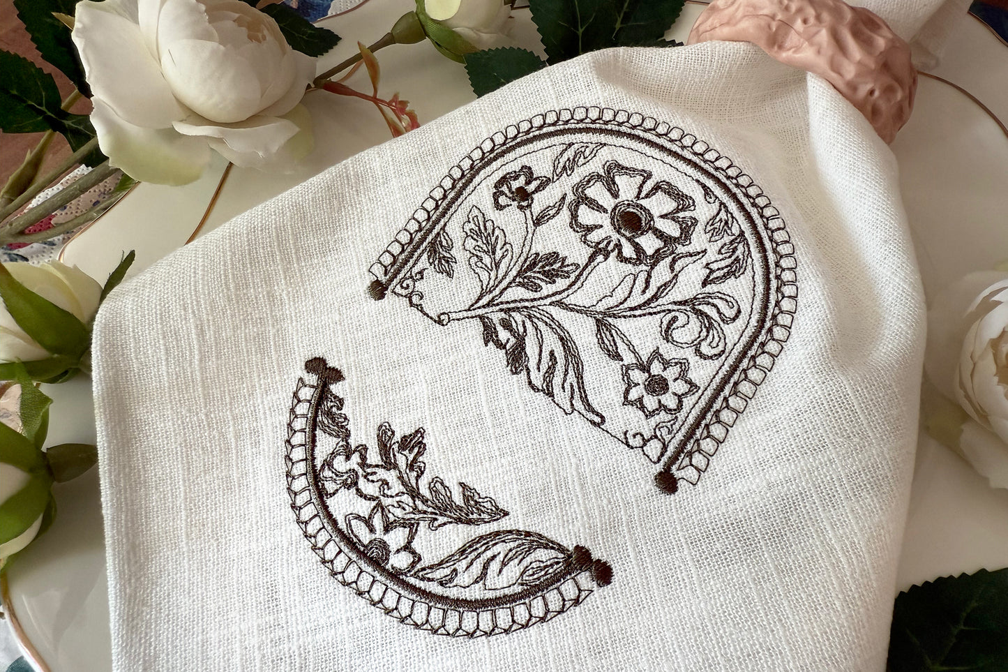 Elegant embroidery frame design with flowers and border