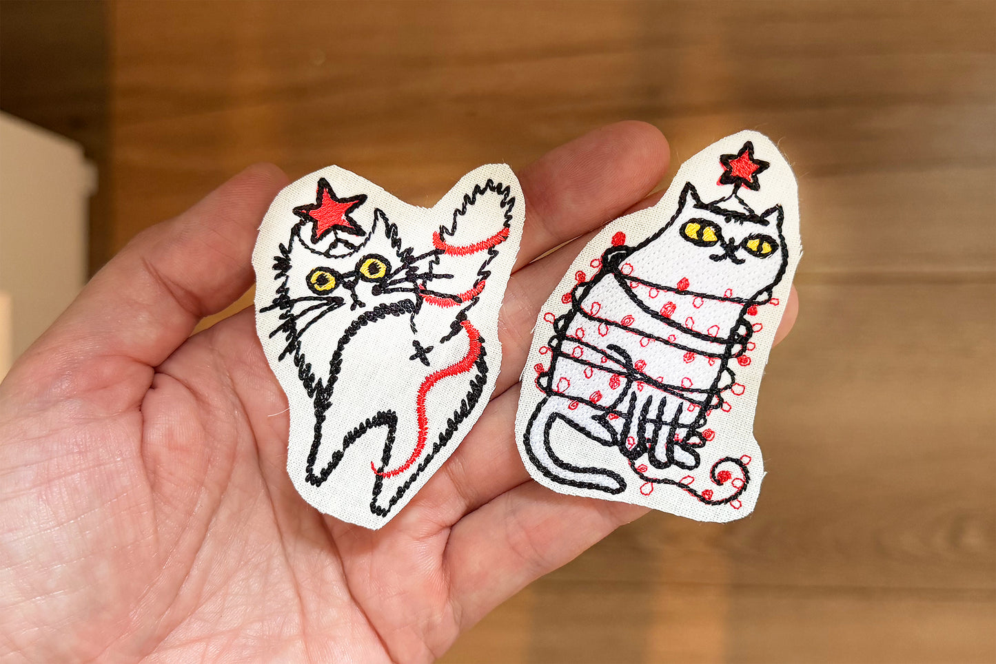 Cute Christmas embroidery cats with festive decorations