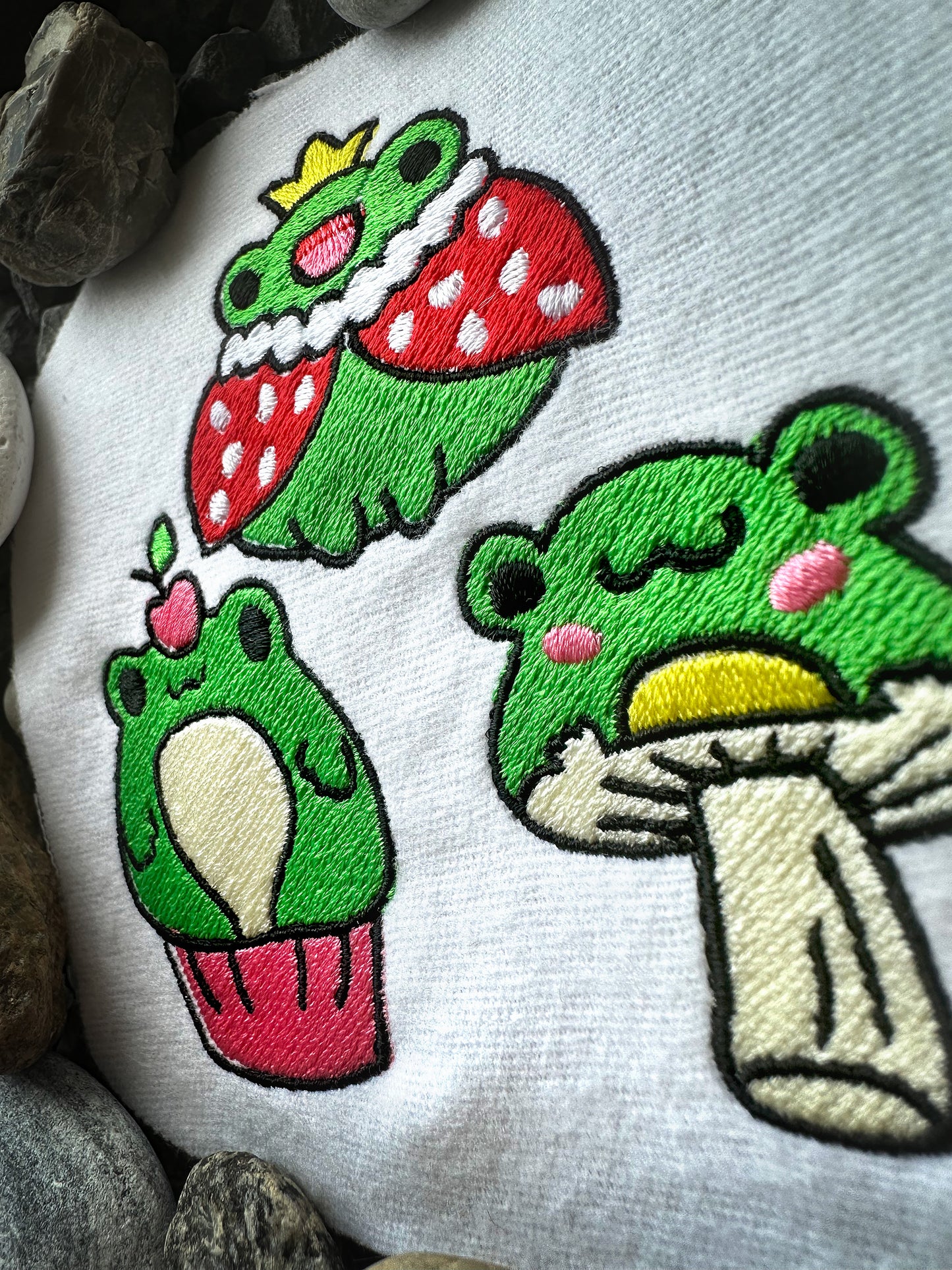 Cartoon-style frogs design for machine embroidery