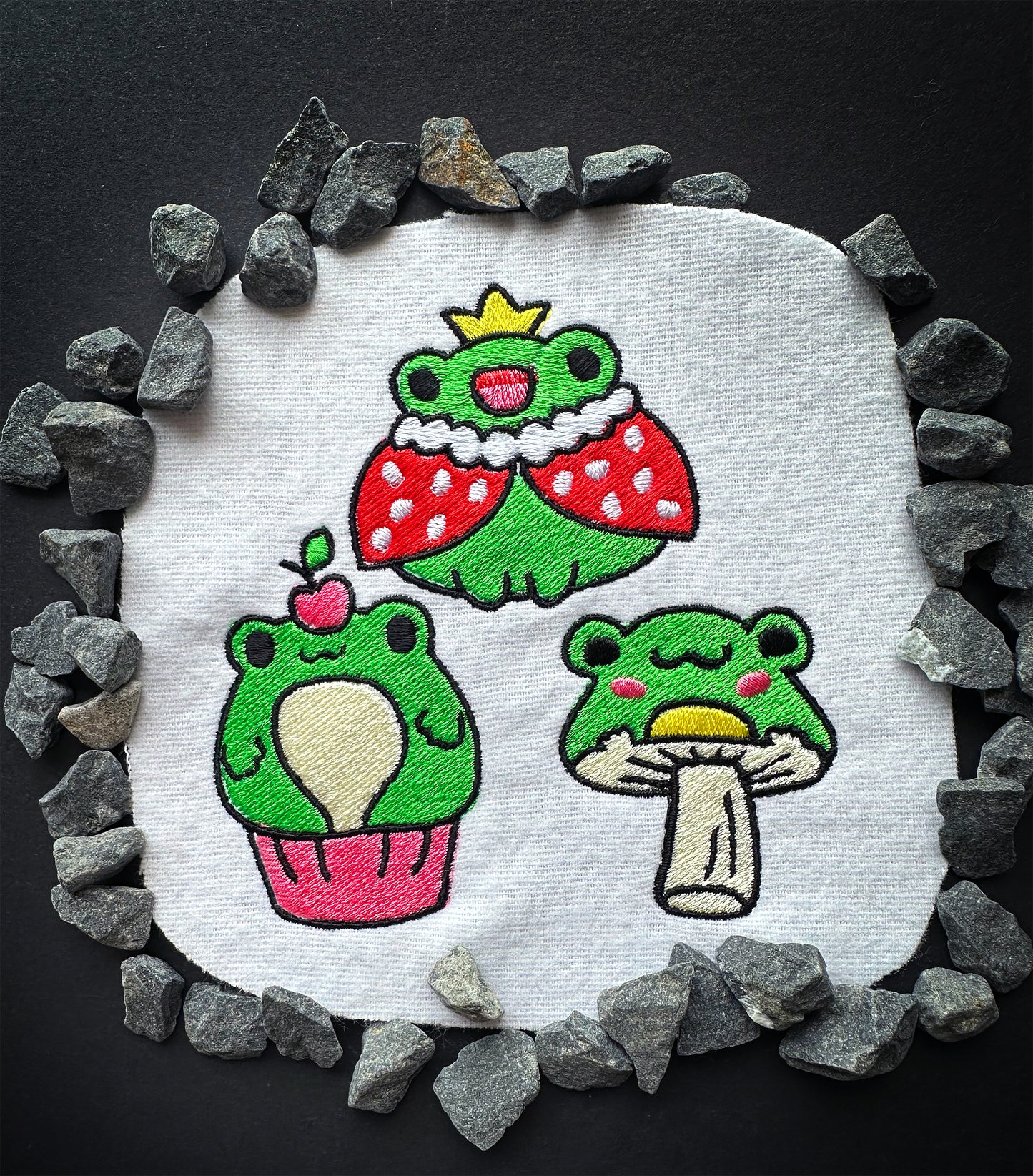 Playful frog embroidery design with bright threads