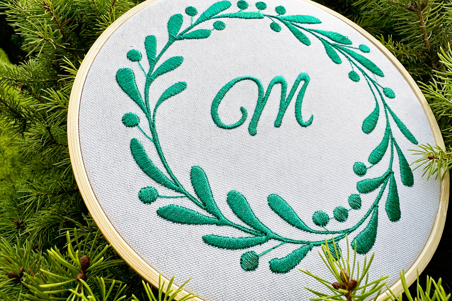 Round floral monogram machine embroidery design