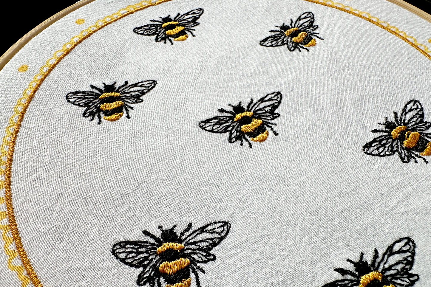 Example of repeated bee embroidery – customizable layout