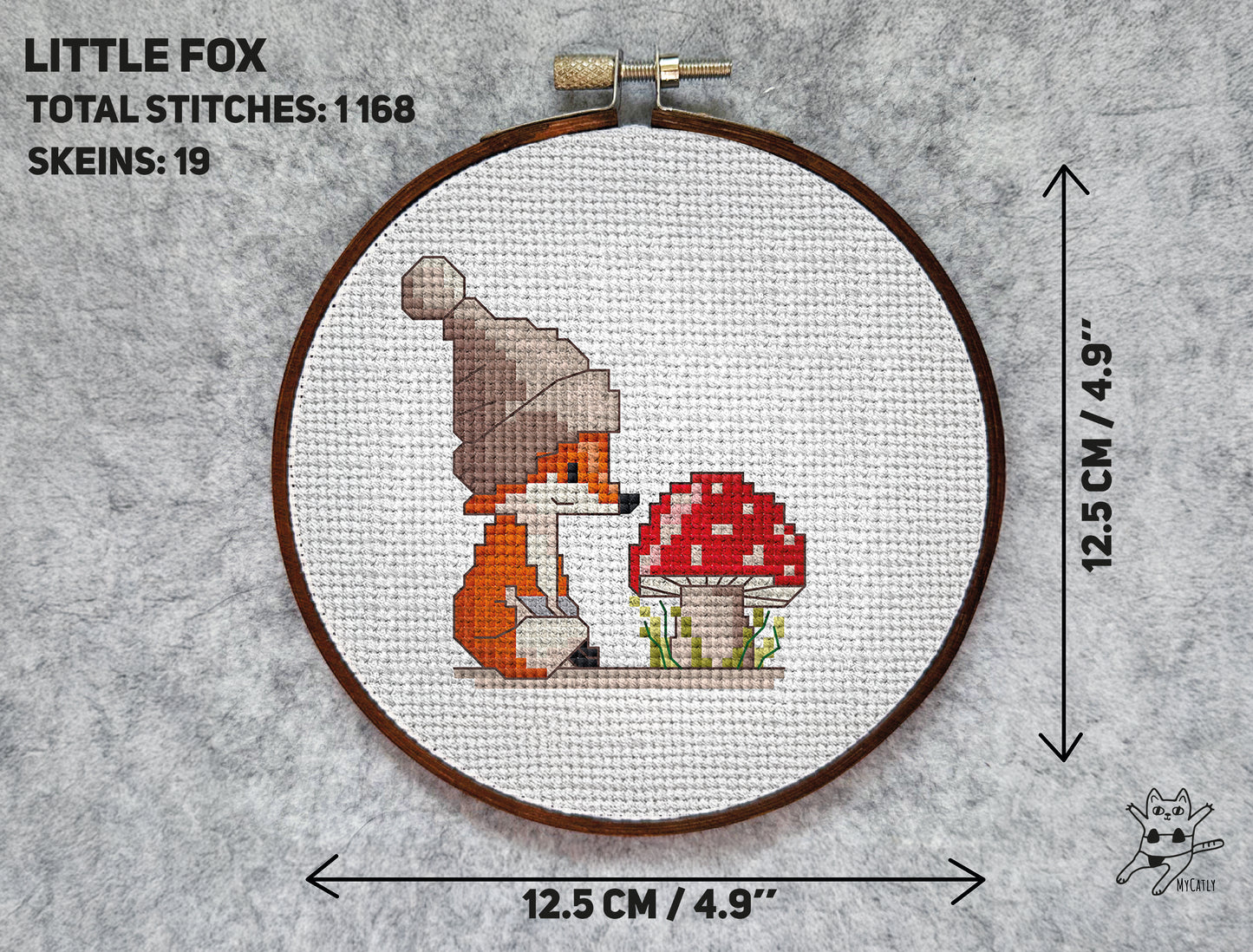 Cross stitch pattern with a little fox in a hat looking at a red mushroom