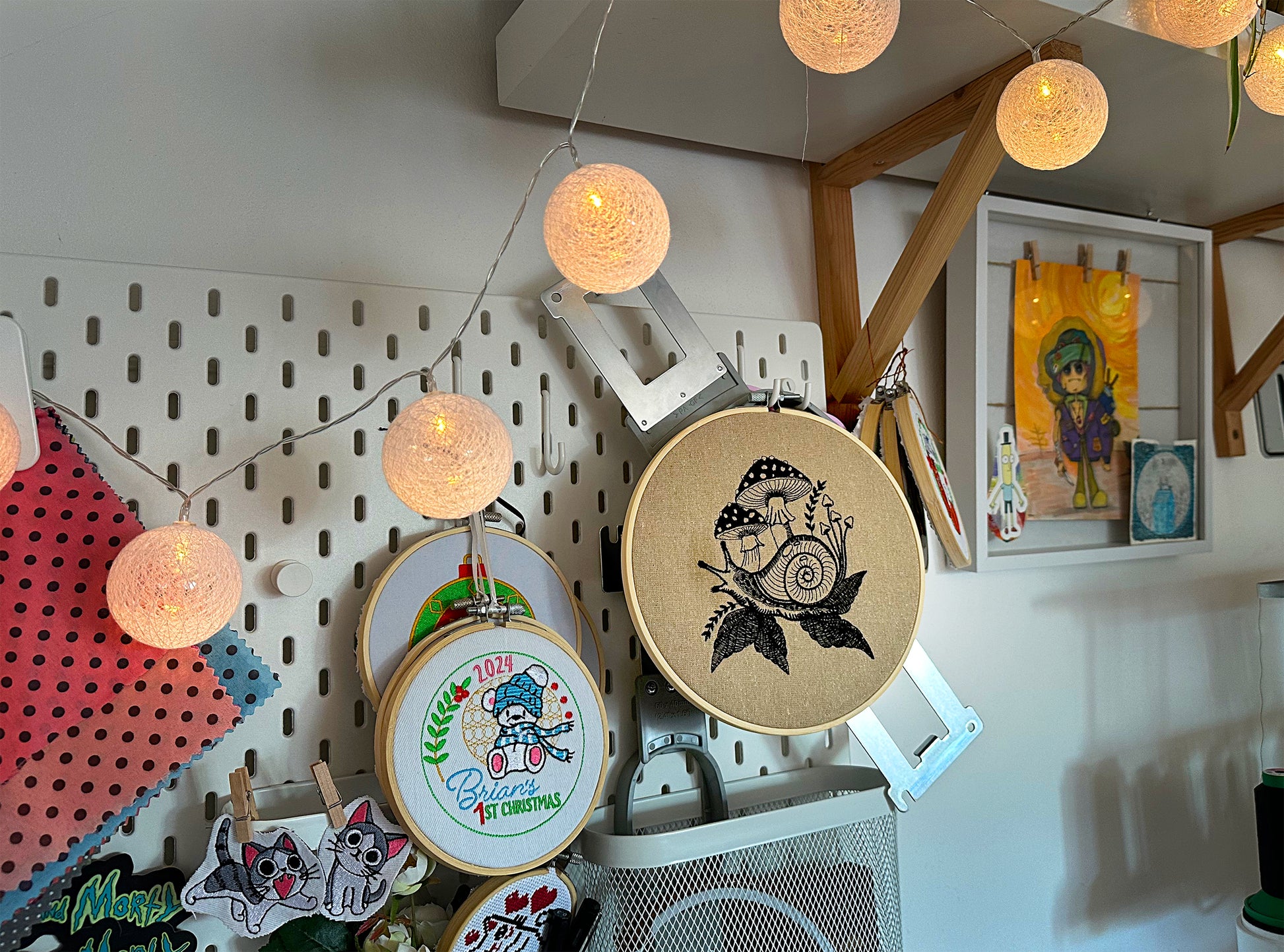 Nature-themed hand embroidery featuring snail and fantasy mushrooms