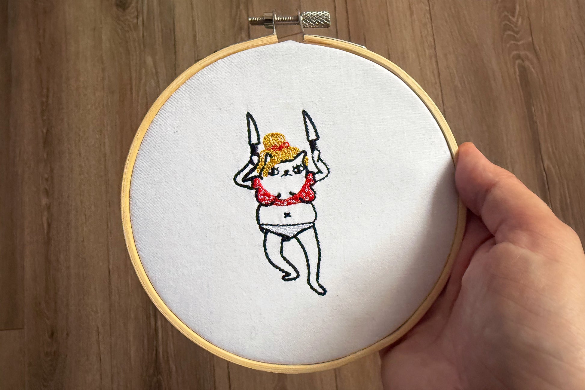 Pop culture cat parody: embroidery of Britney Spears knife dance moment