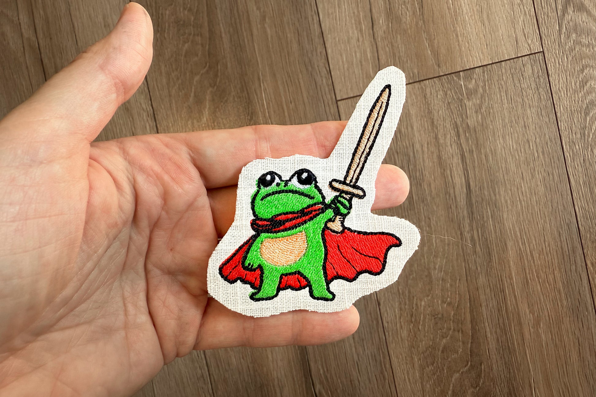 Courageous frog embroidery design with medieval style