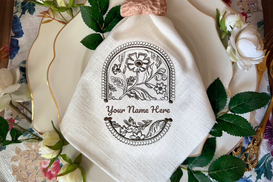 Ornate oval frame machine embroidery with floral details