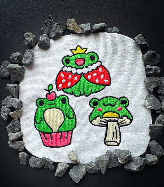 Playful frog embroidery design with bright threads