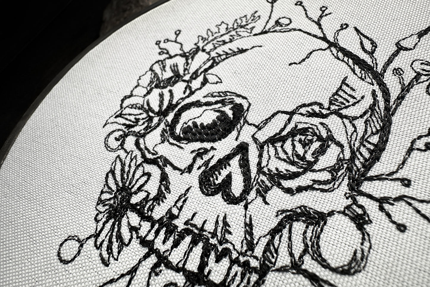 Scull in flowers machine embroidery