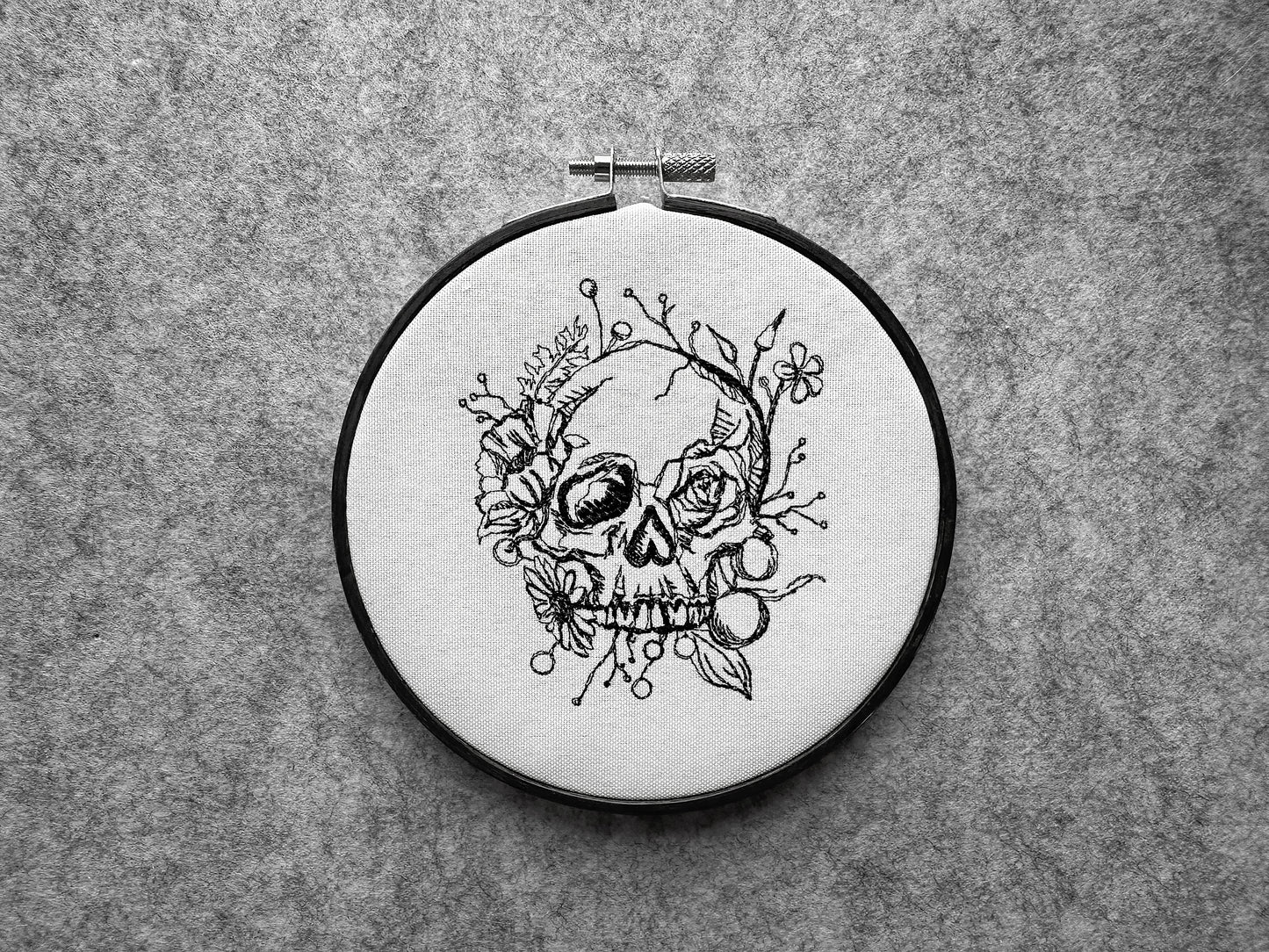 Scull in flowers machine embroidery