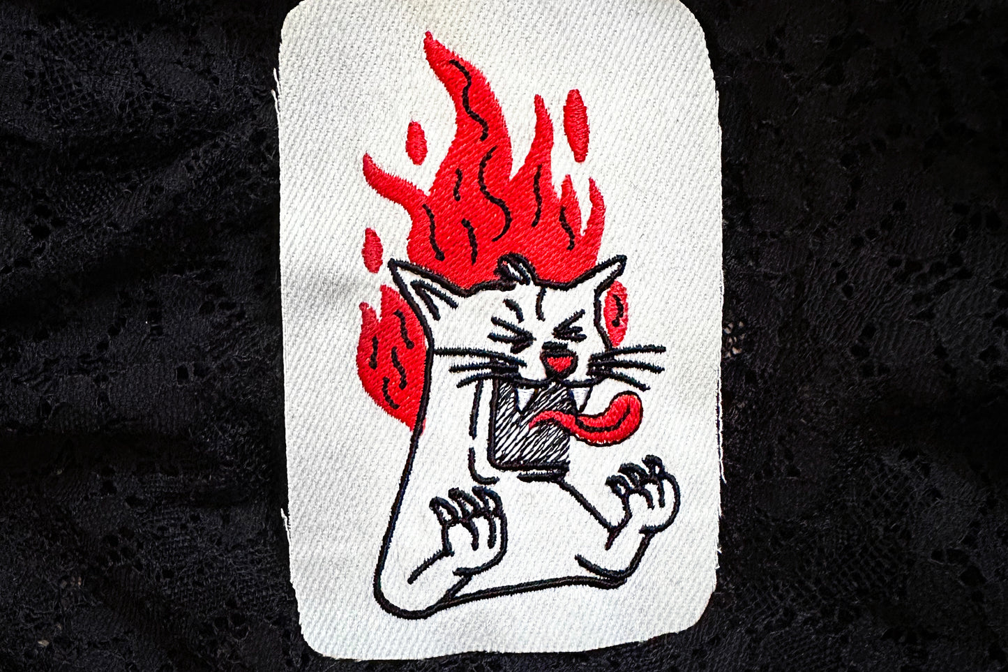 Screaming cat machine embroidery design, cat on fire