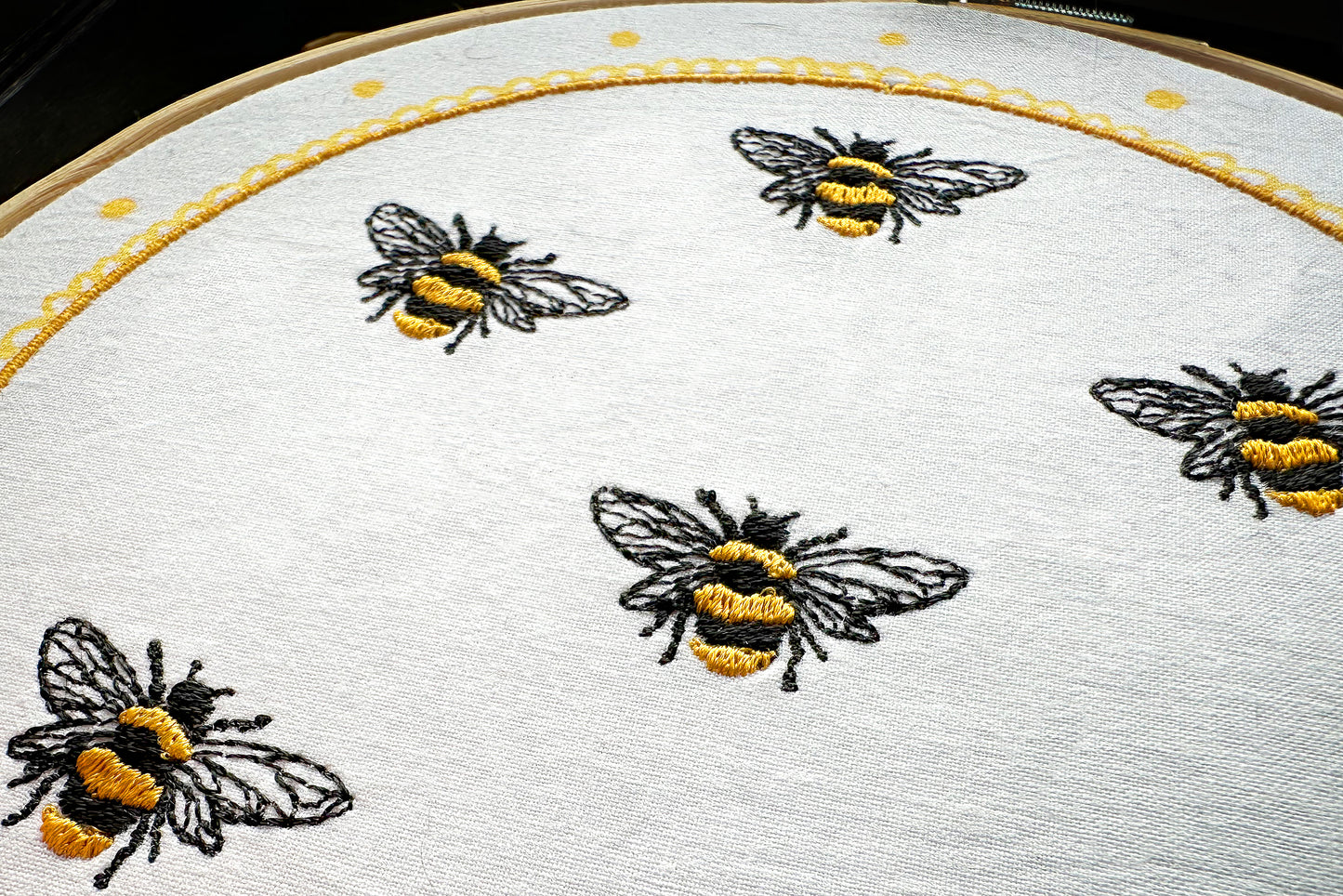 Multiple bees stitched using one embroidery design – variation idea