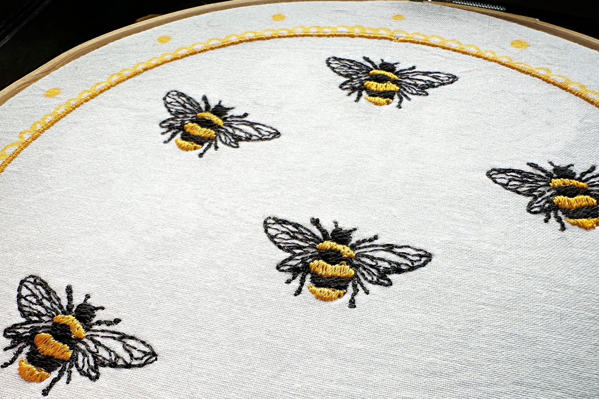 Multiple bees stitched using one embroidery design – variation idea