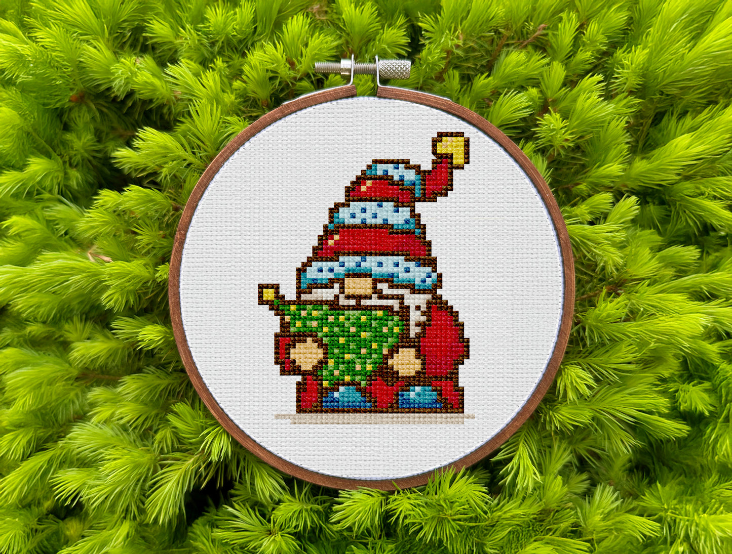 Festive embroidery design with holiday gnome and decorated tree