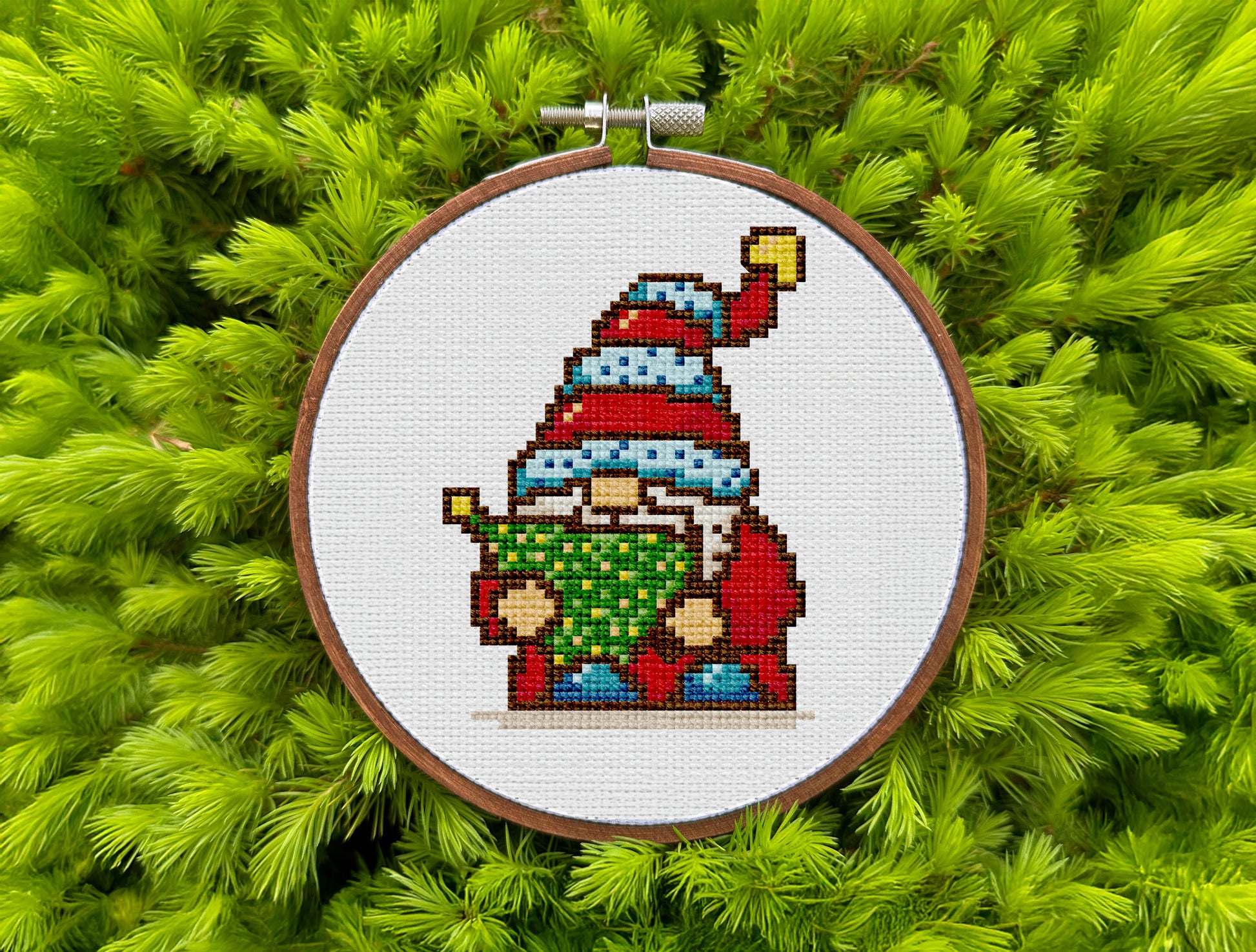 Festive embroidery design with holiday gnome and decorated tree
