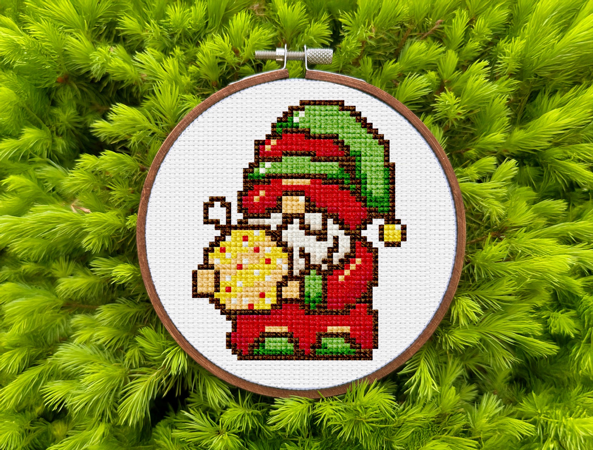 Festive pixel-style cross-stitch pattern with Christmas gnome