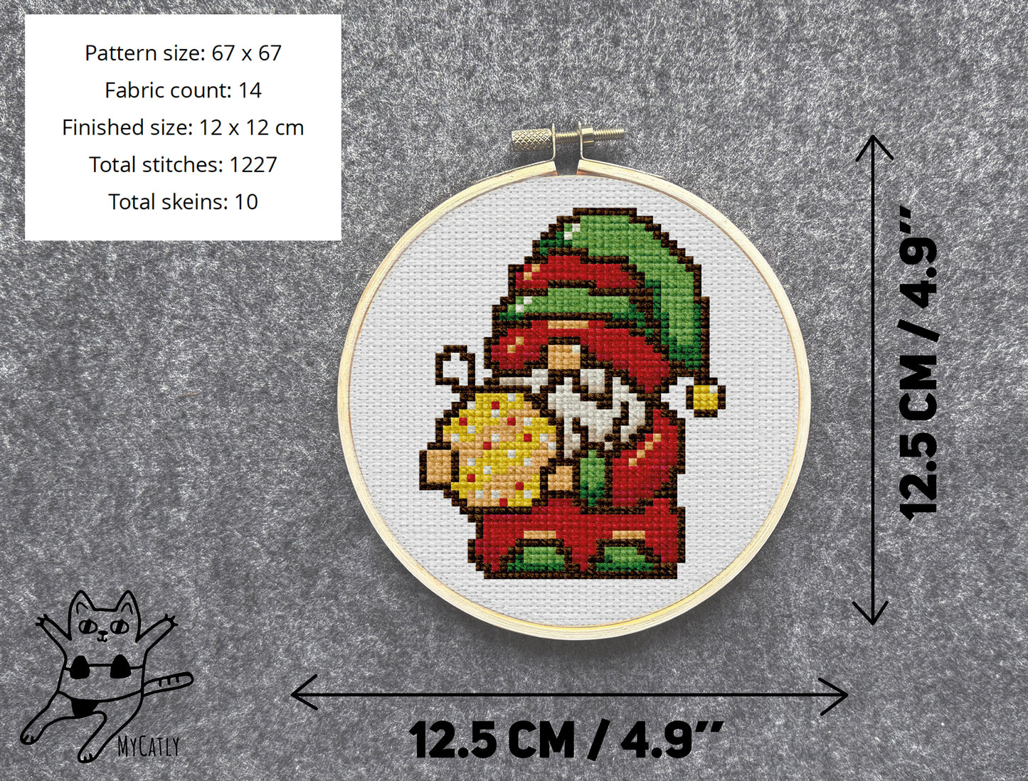 Cross-stitched gnome in an embroidery hoop with dimensions and fabric count details.