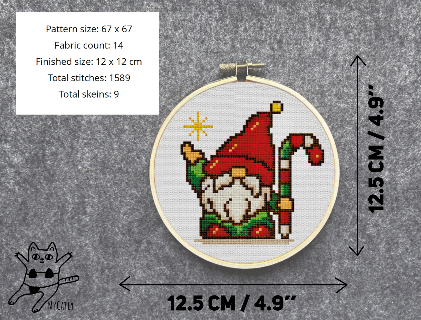 Cross-stitched gnome pattern in a hoop with dimensions and fabric details on a gray background