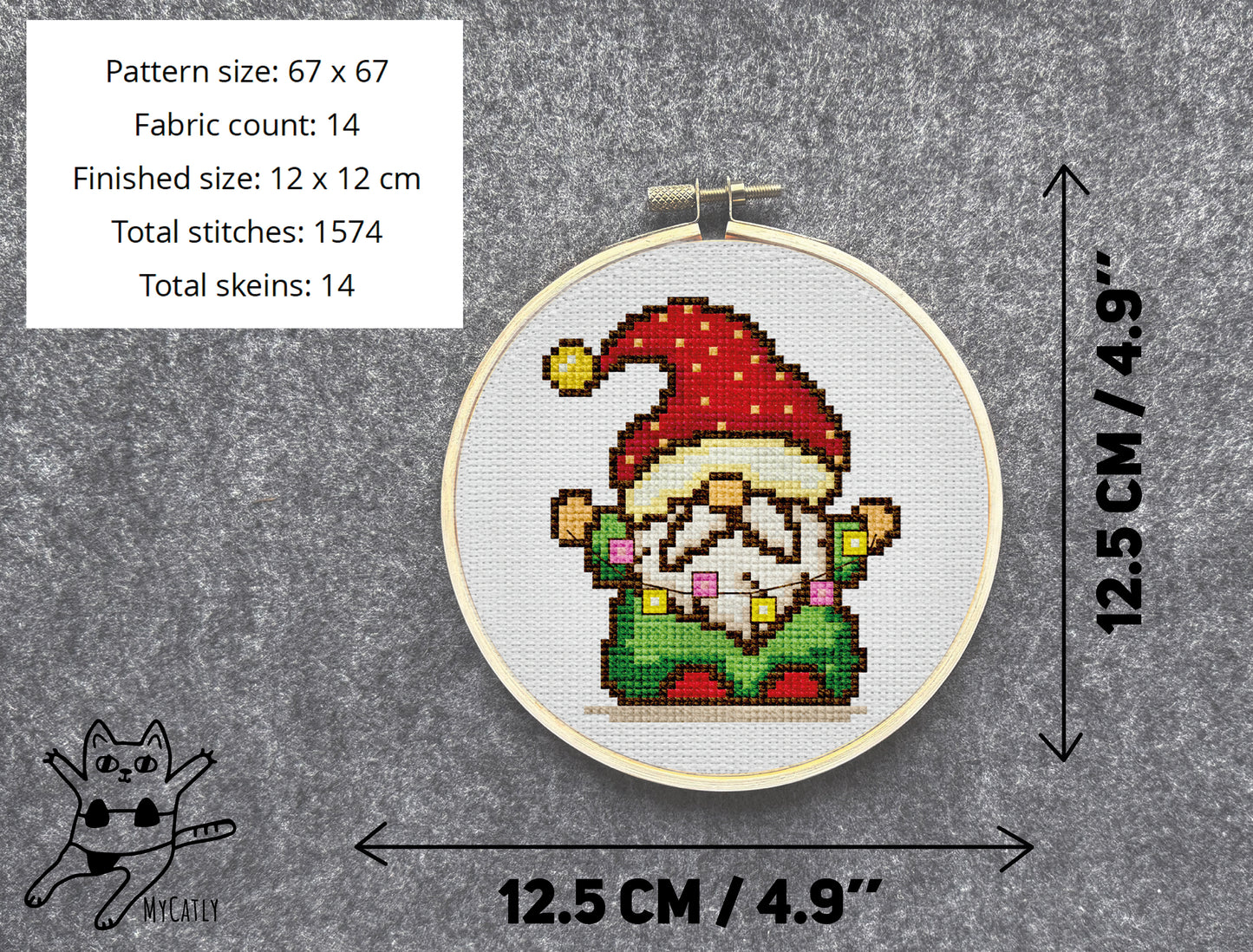 Cross-stitched gnome in a hoop with dimensions and fabric details on a gray background