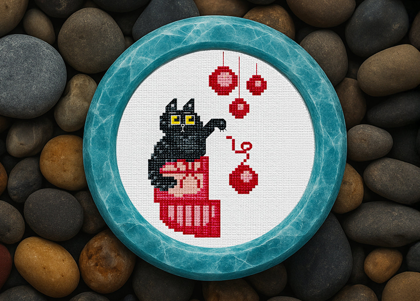 Black cat cross-stitch design with Christmas ornaments