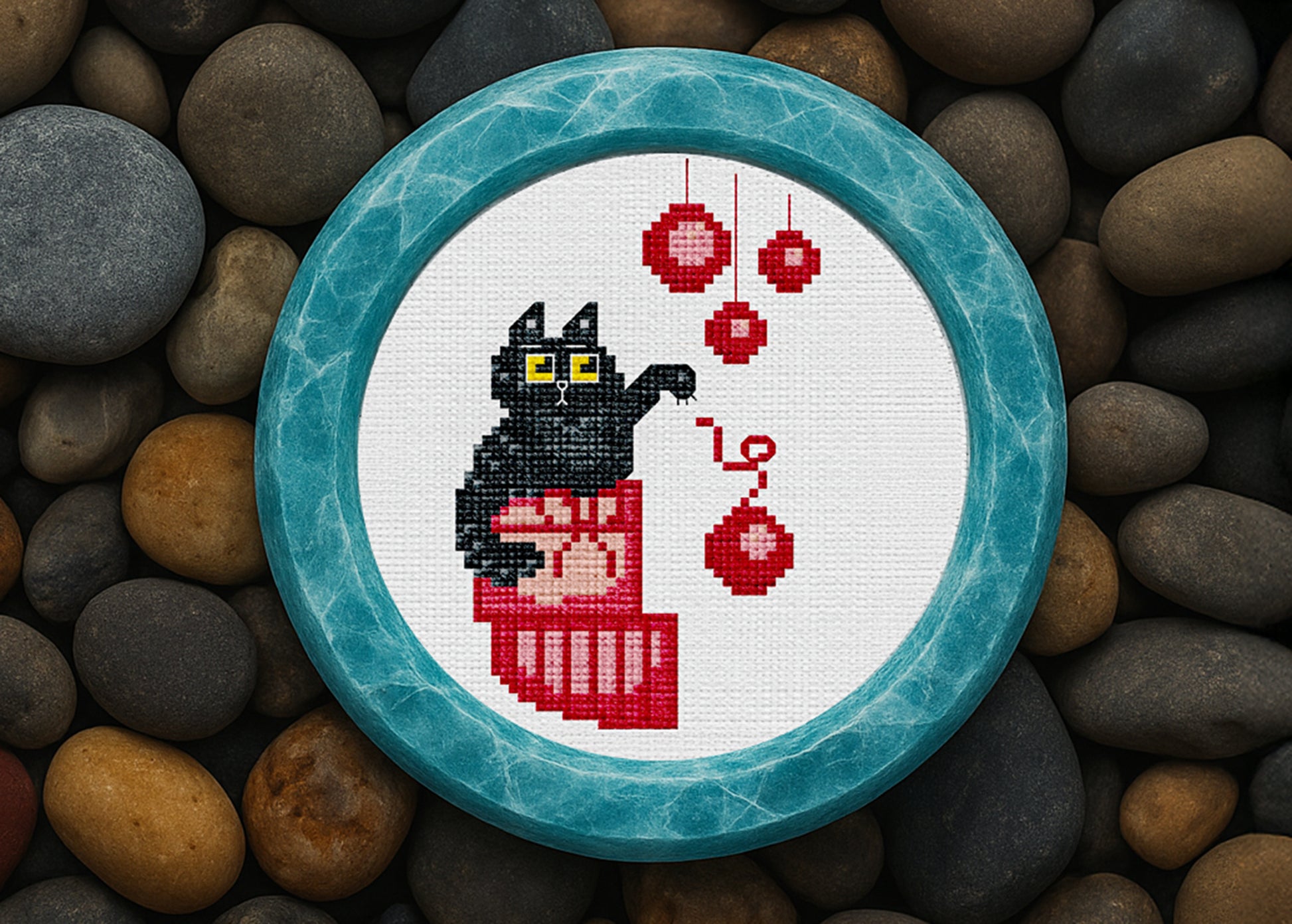 Black cat cross-stitch design with Christmas ornaments